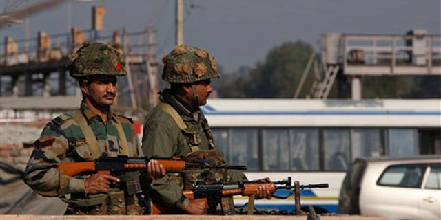 Jan. 2, 2015: Indian soldiers stand outside an Indian air force base in Pathankot, 267 miles north of New Delhi, India