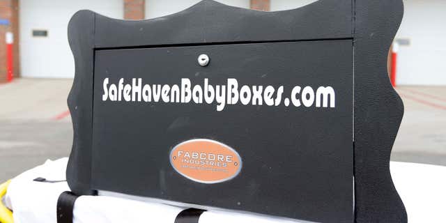 Feb. 26, 2015: A prototype of a baby box, where parents could surrender their newborns anonymously, is shown outside the fire station in Woodburn, Ind.
