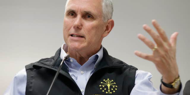 March 25, 2015: Indiana Gov. Mike Pence responds to a question during a news conference.