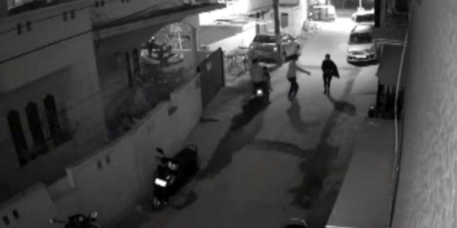 Jan. 1, 2017: This image taken from video shows two men on a scooter assaulting a woman in Bangalore, India