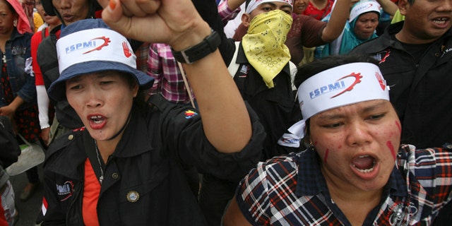 Oct. 3, 2012: Factory workers shout slogans during a protest in medan, North Sumatra, Indonesia.