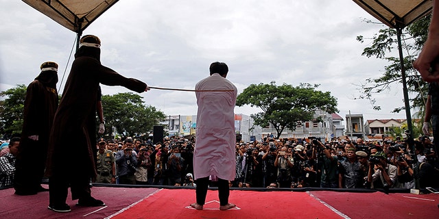 Two Christian Indonesians were caned for gambling, which is against sharia law.