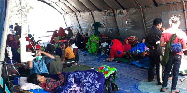 Earthquake survivors receive medical treatment at a temporary shelter in Sembalun, East Lombok, Indonesia.