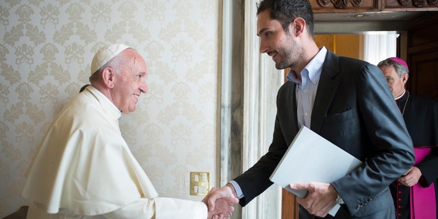 Pope Francis shakes hands with Kevin Systrom, CEO and co-founder of Instagram, during a private audience at the Vatican Friday, Feb. 26, 2016. (L' Osservatore Romano/pool photo via AP)