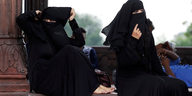 Indian Muslim women rest inside Jama Masjid mosque in New Delhi, India. India's government has approved an ordinance to implement a top court ruling striking down the Muslim practice that allows men to instantly divorce.