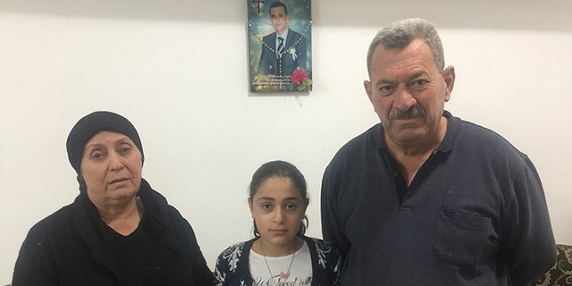Rimon’s family (mother Silvia, father Matti and younger sister Cariss) mourning his death earlier this year. He was diagnosed with cancer but unable to receive adequate medical attention or leave the country.