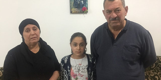 Rimon’s family (mother Silvia, father Matti and younger sister Cariss) mourning his death earlier this year. He was diagnosed with cancer but unable to receive adequate medical attention or leave the country.