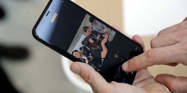 The new picture controls features are shown on an iPhone XR during an event to announce new products Wednesday, Sept. 12, 2018, in Cupertino, Calif. (AP Photo/Marcio Jose Sanchez)
