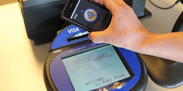 Technology manufacturers and credit card companies are pushing for new standards for mobile payments -- relying on just a wave of your cell phone.