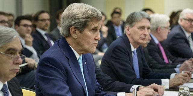 March 31, 2015: U.S. Secretary of State John Kerry, second left, U.S. Secretary of Energy Ernest Moniz, left, British Foreign Secretary Philip Hammond, center, Russian Deputy Foreign Minister Sergei Ryabkov, second right, and German Foreign Minister Frank Walter Steinmeier wait for the start of a meeting on Iran's nuclear program with other officials from France, China, the European Union and Iran at the Beau Rivage Palace Hotel in Lausanne, Switzerland.