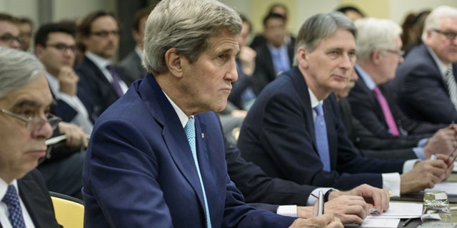 March 31, 2015: U.S. Secretary of State John Kerry, second left, U.S. Secretary of Energy Ernest Moniz, left, British Foreign Secretary Philip Hammond, center, Russian Deputy Foreign Minister Sergei Ryabkov, second right, and German Foreign Minister Frank Walter Steinmeier wait for the start of a meeting on Iran's nuclear program with other officials from France, China, the European Union and Iran at the Beau Rivage Palace Hotel in Lausanne, Switzerland.