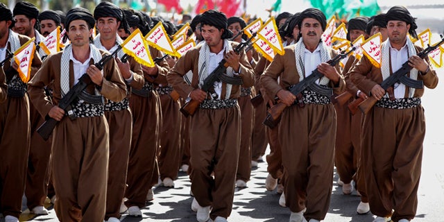 Sept, 22, 2013: Kurd volunteer members of Basij, the Revolutionary Guards paramilitary branch, march during an annual military parade in Tehran, Iran.