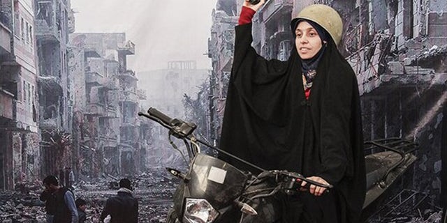 An Iranian woman poses in front of a war scene from Syria.