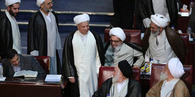 Tuesday: Former influential President Akbar Hashemi Rafsanjani, center, a member of Iran's Experts Assembly, arrives to attend the assembly's seasonal meeting, in Tehran, Iran. The Experts Assembly is a powerful clerical body with the right to monitor the performance of Iran's supreme leader.