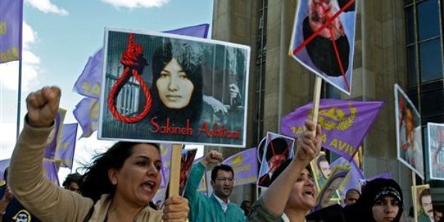 Aug 28, 2010:Supporters of National Council of Resistance of Iran in France, protest the death sentence of Sakineh Mohammadi Ashtiani, at Trocadero square in Paris. Ashtiani's sentence of death by stoning, which Iran has put on hold, has brought harsh condemnation from the U.S. , the European Union and rights groups who are demanding Tehran stay the execution.