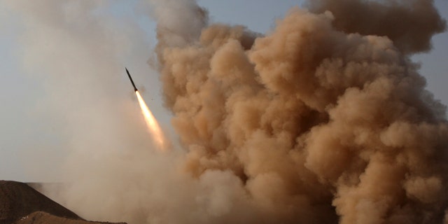 In this photo released by the semi-official Iranian Fars News Agency, and taken on Tuesday, June 28, 2011, a Zelzal missile is launched by the Iranian revolutionary Guards during their maneuvers outside the city of Qom, Iran.