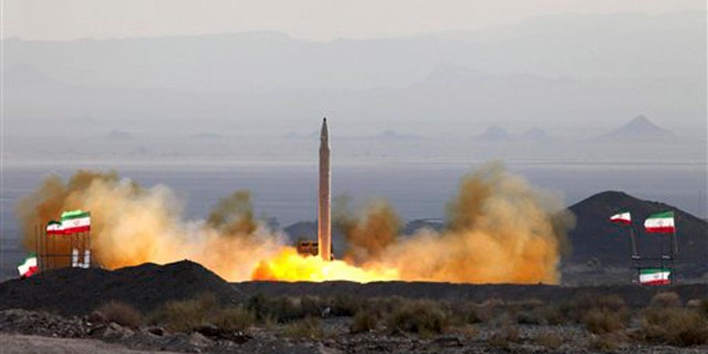 This Aug. 20 photo, by the Iranian Defense Ministry, claims to show the launch of the Qiam-1 liquid-fueled missile by Iranian armed forces, at an undisclosed location. It is an example of Iran's potential retaliatory power. (AP Photo)