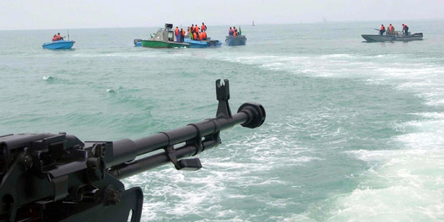 In this file photo taken on April 3, 2006, members of Iran's elite Revolutionary Guard attend maneuvers in the Persian Gulf.