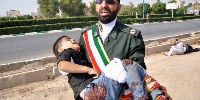 Gunmen attacked the military parade, killing at least 25 people, state media said.