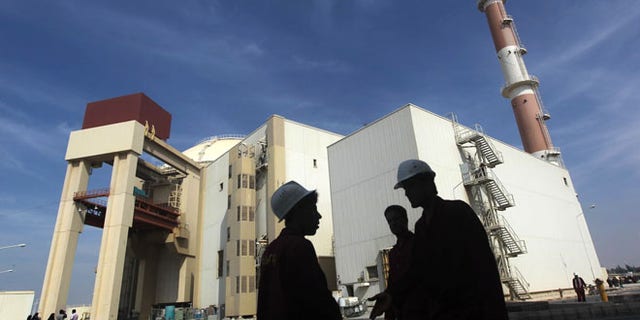 Oct. 26, 2010: Iranian workers stand in front of the Bushehr nuclear power plant, about 1,200 km south of Tehran. (Reuters)