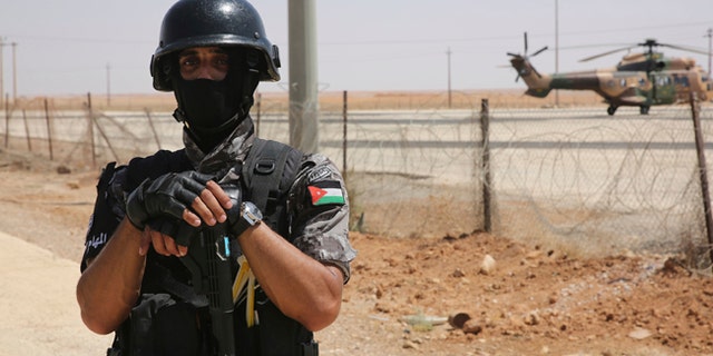 A Jordanian soldier stands guard the Iraq-Jordan border on Aug. 30, 2017.