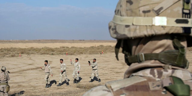 Nineveh police forces train with coalition partners southeast of Baghdad.