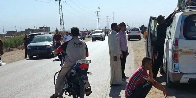 April 15, 2015: People leave their hometown Ramadi, 70 miles west of Baghdad, Iraq. The Islamic State group launched an offensive in Iraq's western Anbar province on Wednesday, capturing three villages near the provincial capital of Ramadi where fierce clashes were underway between the extremists and government troops, residents said.