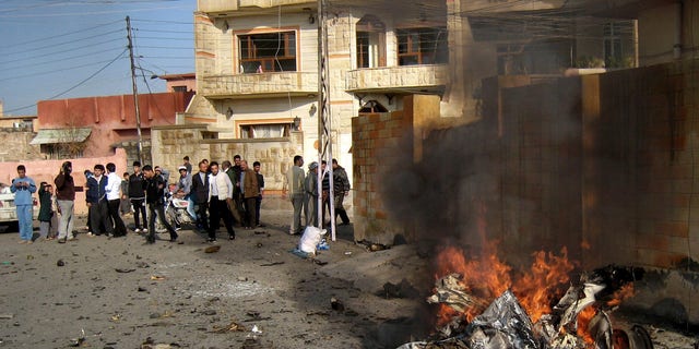 Nov. 27, 2012: Iraqis inspect the scene of a bomb attack in Kirkuk, 180 miles north of Baghdad, Iraq.