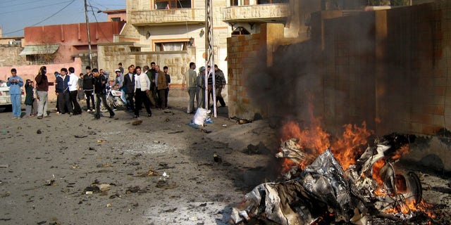 Nov. 27, 2012: Iraqis inspect the scene of a bomb attack in Kirkuk, 180 miles north of Baghdad, Iraq.