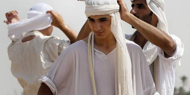 The Baptism Festival in Basra, Iraq. (AP Photo/ Nabil al-Jurani)