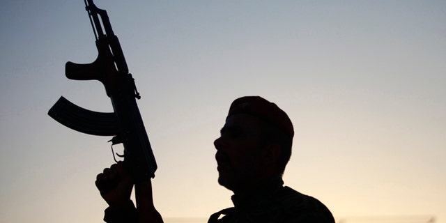 June 26, 2014: A member of an Iraqi volunteer forces group joins training near the Imam Ali shrine in the southern holy Shiite city of Najaf, Iraq.