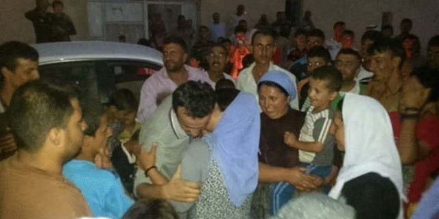 Four months after his capture, Saido had a reunion with his family.