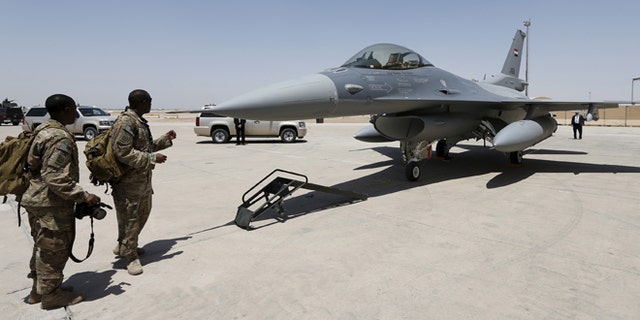July 20, 2015: U.S. Army soldiers look at a F-16 fighter jet during an official ceremony to receive four of these aircrafts from the U.S., at a military base in Balad, Iraq. (Reuters)