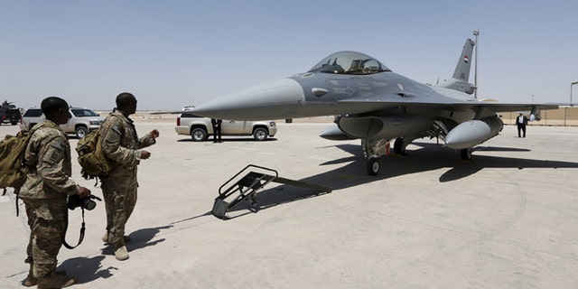 July 20, 2015: U.S. Army soldiers look at a F-16 fighter jet during an official ceremony to receive four of these aircrafts from the U.S., at a military base in Balad, Iraq. (Reuters)
