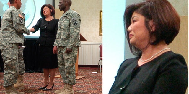 Irene Martin, the US Citizenship and Immigration Services field boss who clashed with federal law enforcement agents, is shown here in file photo greeting Spc. Brent Kiley, of the US Army’s 11th Armored Cavalry Regiment.