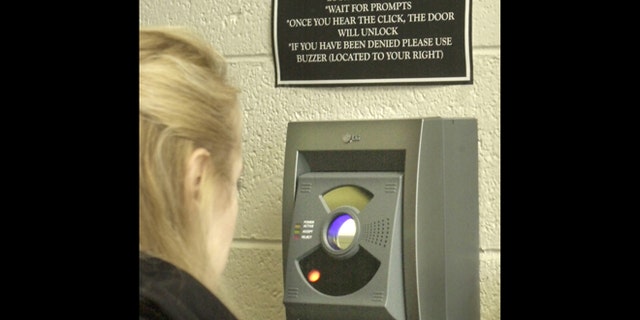 An iris-recognition scanner is used to gain entrance to a New Egypt, N.J., elementary school in 2003.