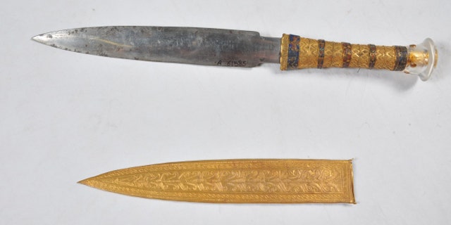 This undated image shows a dagger and sheath found in the tomb of the Egyptian pharaoh Tutankhamun