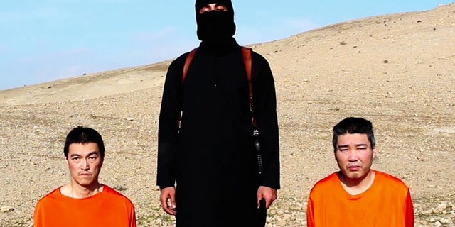 This image taken from an online video released by the Islamic State group's al-Furqan media arm on Tuesday, Jan. 20, 2015, purports to show the group threatening to kill two Japanese hostages that the militants identify as Kenji Goto Jogo, left, and Haruna Yukawa, right, unless a $200 million ransom is paid within 72 hours. Japan's Foreign Ministry's anti-terrorism section has seen the video and analysts are assessing it, a ministry official said on Tuesday. (AP Photo)