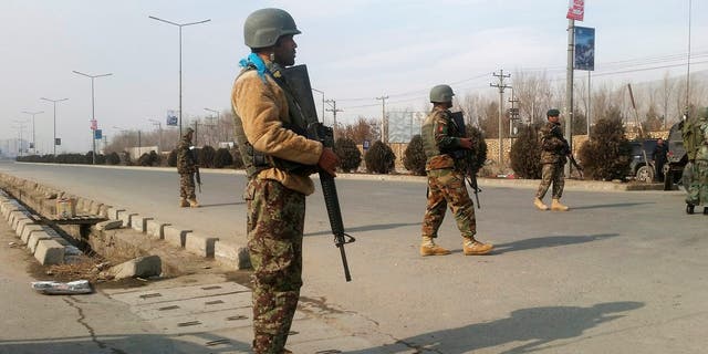 Afghan security forces keep watch at the site of an attack in Kabul, Afghanistan December 18 ,2017. REUTERS/Omar Sobhani - RC1BDDD0B8C0