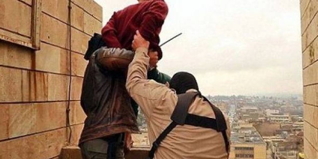 ISIS militants are seen throwing a suspected gay man off of a rooftop.