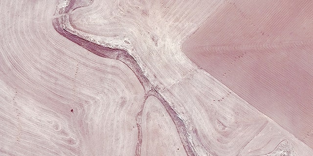 This satellite image shows a suspected mass grave site next to a ravine at Badoush Prison in Mosul, Iraq, on July 17, 2014.