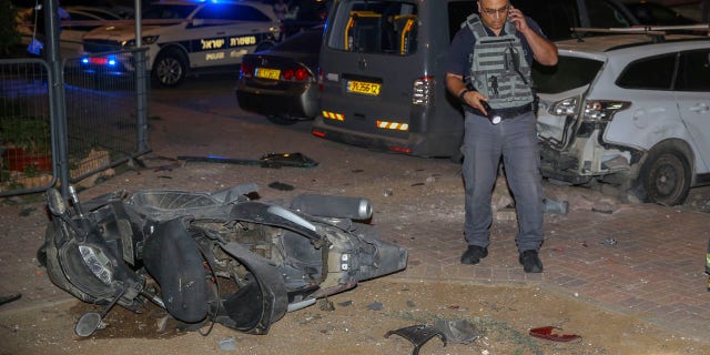 A security officer standing near the site of a rocket strike in Sderot, Israel, on Wednesday.