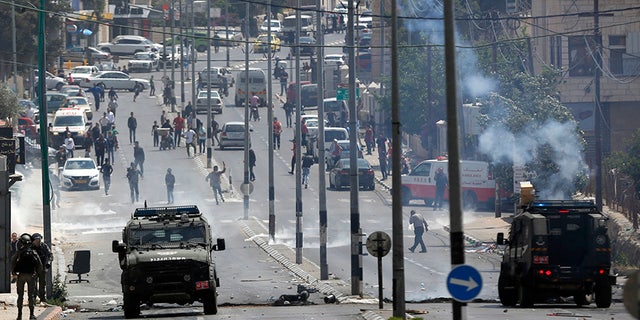 May 14, 2018: Palestinians clash with Israeli troops following a protest against the opening of the U.S. embassy in Jerusalem, in the West Bank city of Bethlehem.
