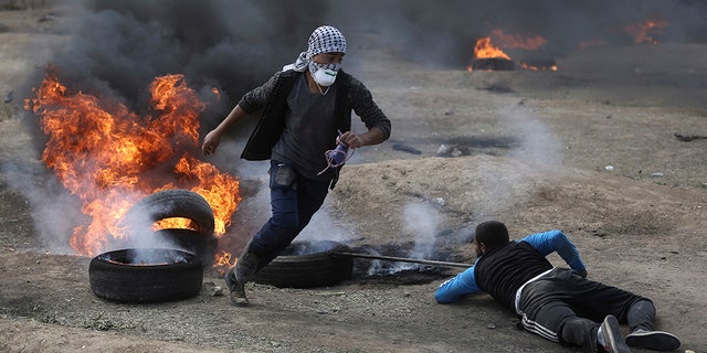 Protesters lit tires on fire and threw incendiary projectiles to protest as the US officials opened its new embassy in Jerusalem.