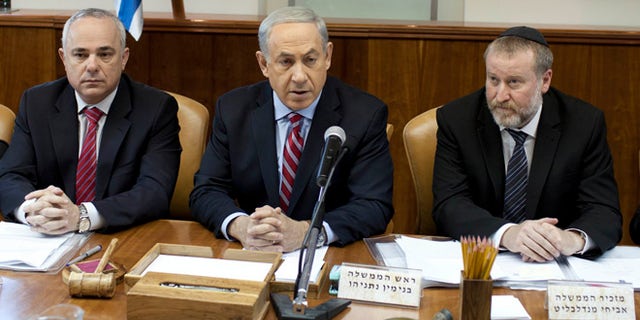 Nov. 24, 2013: Israeli Prime Minister Benjamin Netanyahu, center, attends the weekly cabinet meeting at his office in Jerusalem, Israel.