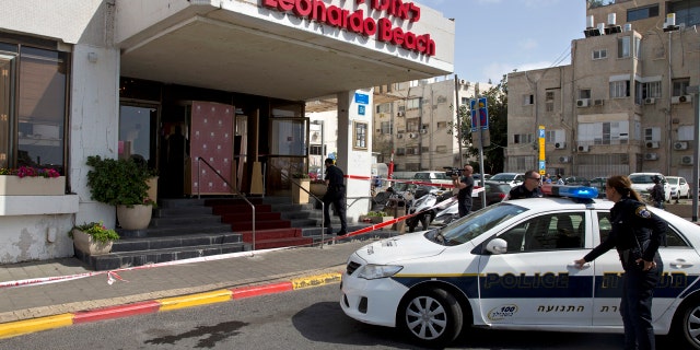 Israeli police officers stand guard at the scene of a stabbing attack in Tel Aviv, Israel. Sunday, April 23, 2017.