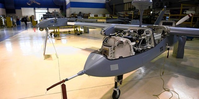 Israel pioneered the use of aerial drones like the Heron, under construction, above, at Israeli Aerospace Industries. (David Furst/AFP for The Wall Street Journal)