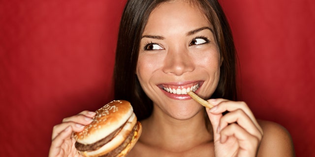 A high school senior decided to use McDonald's at the backdrop for her senior photos.