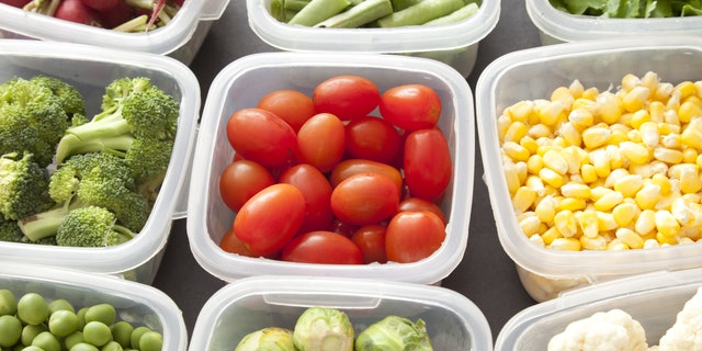 Different types of veggies each in a platic container