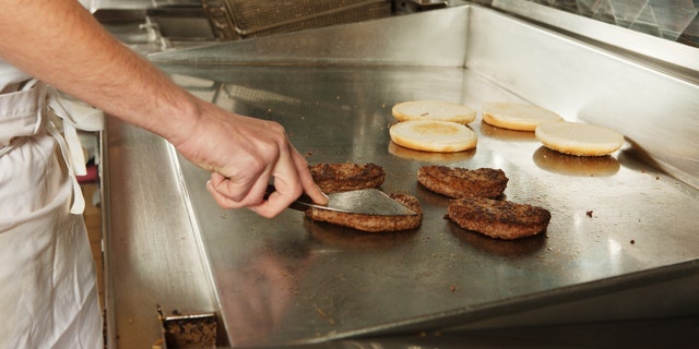 Cooking burgers in a fastfood restaurant